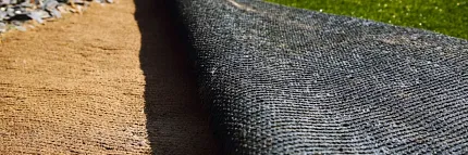 Durable outdoor carpet for garden paths Close-up of outdoor carpet on grass and gravel