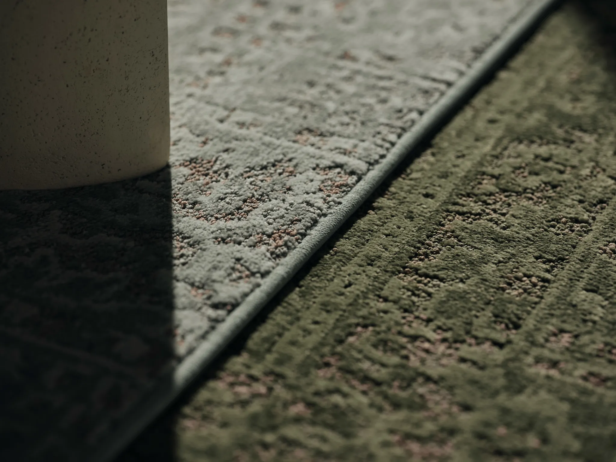Close-up of broadloom carpet in gray and green tones