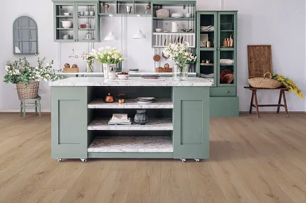 Coretec Residential WPC Luxury Vinyl Plank Flooring - 60x7.13 inch Wood Look Modern kitchen with green cabinets and Coretec Residential WPC luxury vinyl plank flooring in a wood look