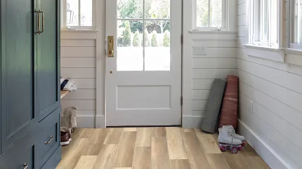 Light Oak Luxury Vinyl Plank Flooring in Entryway - Durable and Easy to Maintain 48x7 inch SPC Residential Flooring Entryway with light oak luxury vinyl plank flooring, showcasing a cozy and practical home environment