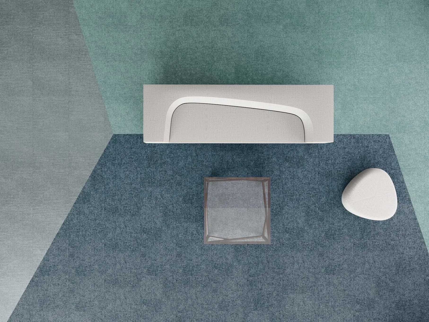 Modern office space with geometric patterned carpet in shades of blue and green, featuring a white bench and a small table