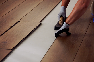 A COREtec luxury vinyl floor being installed in a home