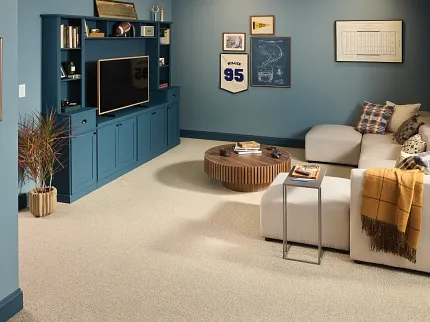 Comfortable and Durable Beige Carpet Flooring in a Cozy Living Room Setting Cozy living room with beige carpet flooring, blue walls, and a comfortable sectional sofa