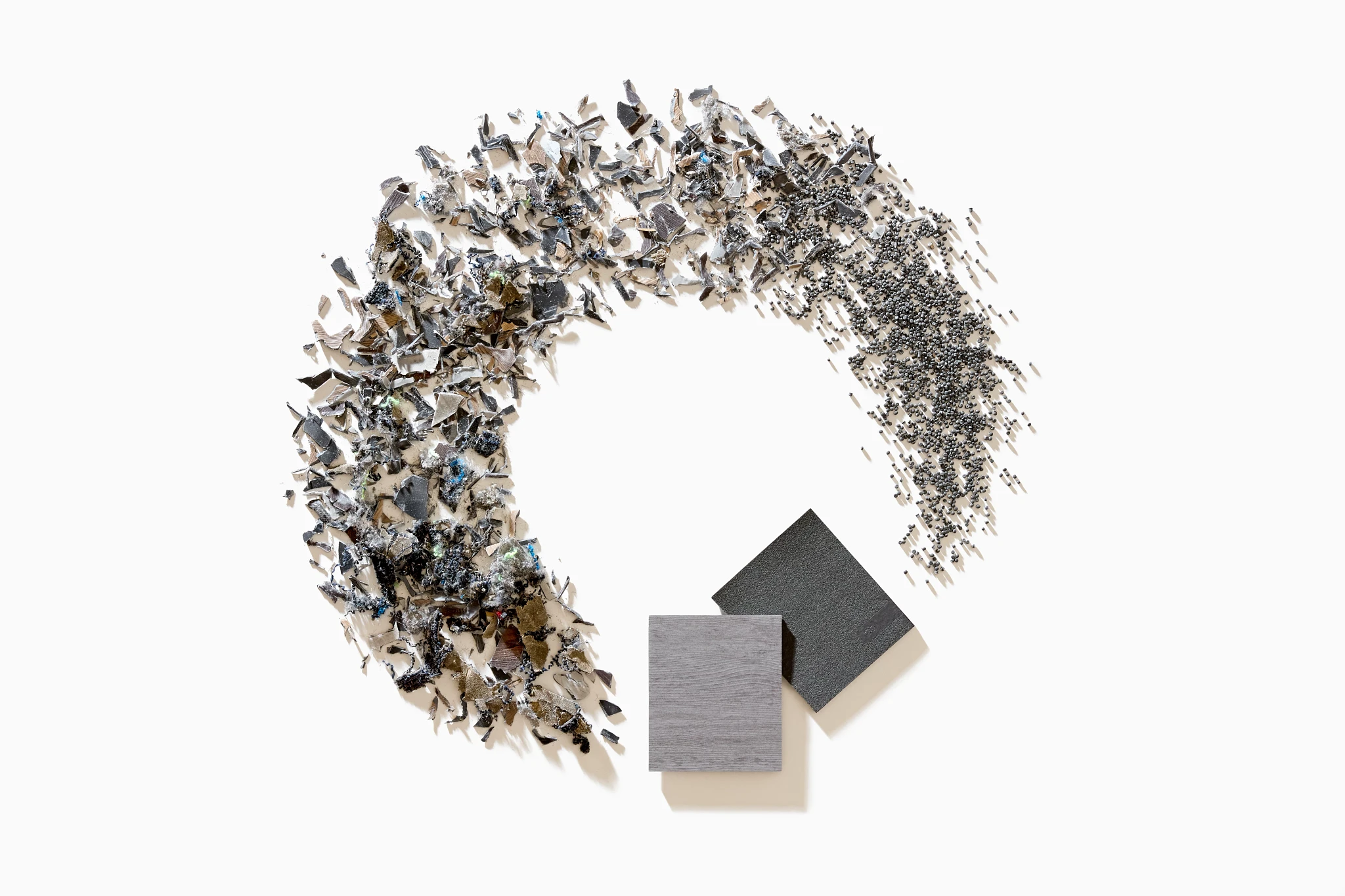 PVC-Free EcoWorx Resilient flooring swatch in gray and black with construction materials