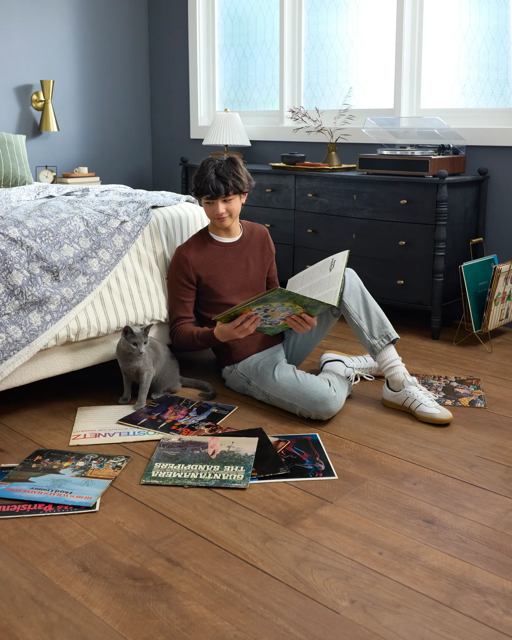Coretec Residential WPC vinyl flooring in a cozy bedroom with records and a cat