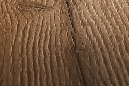 Wood Look Luxury Vinyl Plank Flooring - Warm Brown Texture Close-up of wood grain texture on luxury vinyl plank flooring in warm brown tones