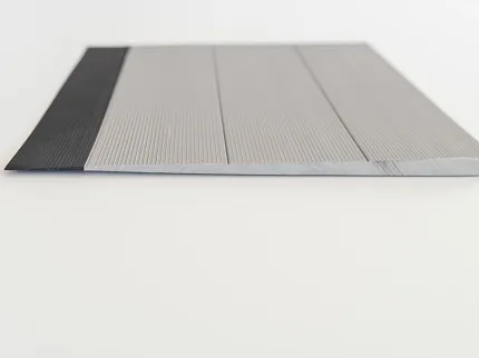 Black and Gray Striped Commercial Flooring Swatch with Textured Surface Close-up view of a commercial flooring swatch featuring a black and gray striped design with a textured surface