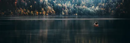 Misty Forest and Lake Reflection Scene Scenic view of a misty forest with autumn colors reflected on a calm lake