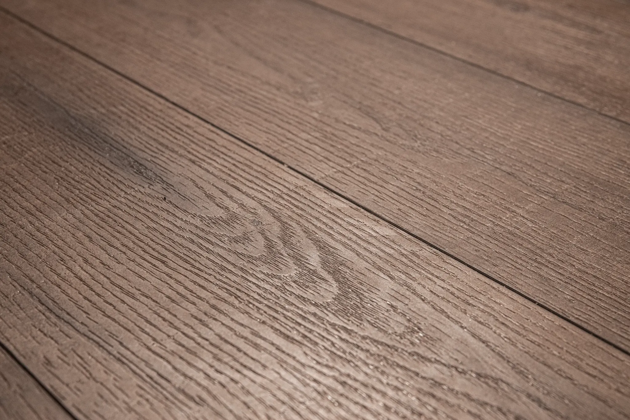 Close-up dark wooden Coretec floor