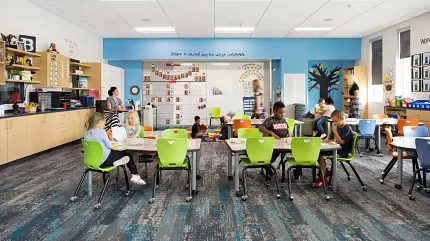 K-12 Education Facility Classroom with Commercial Carpet Tile Flooring Classroom with colorful chairs and educational decor featuring Commercial Carpet Tile flooring in a K-12 Education Facility