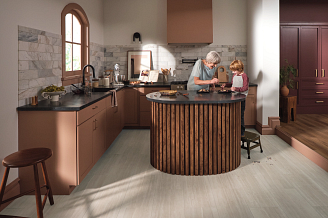woman and grandson in kitchen featuring coretec tile luxury vinyl flooring