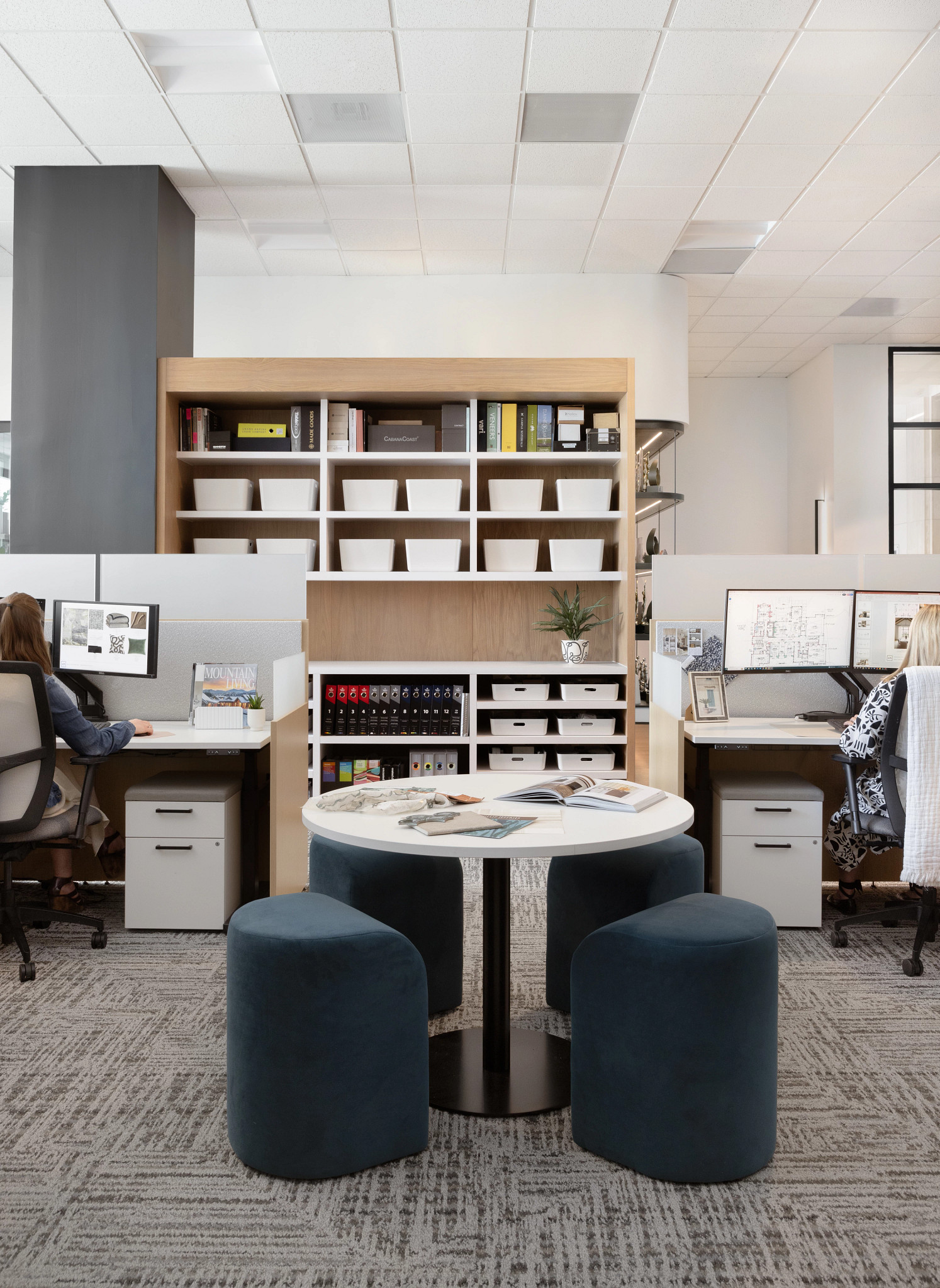 Office space with 18x36 inch carpet tile flooring and modern workstations