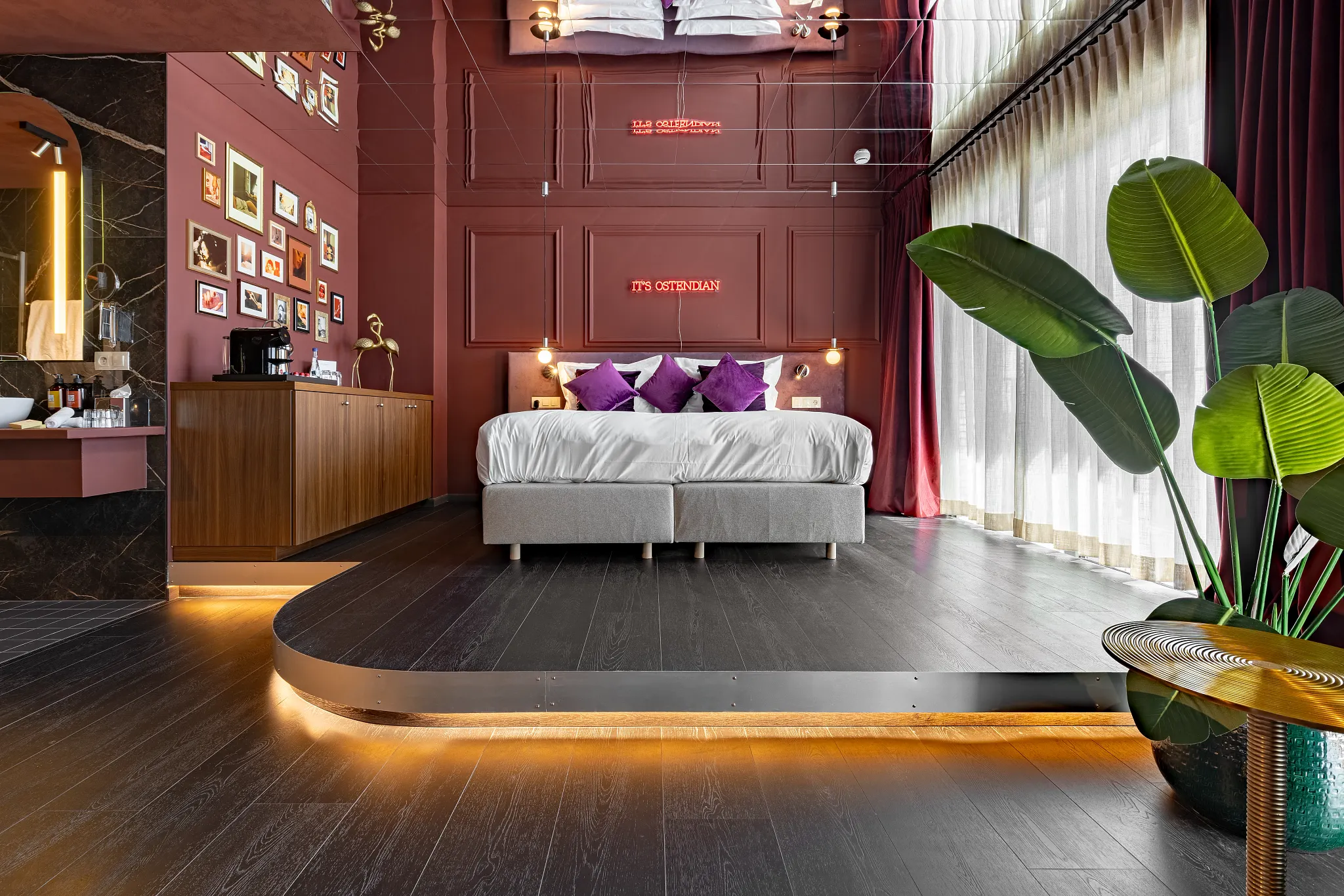 Dark moody hotel room with black Coretec LVT floors