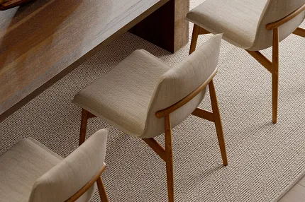 Elegant dining room featuring 100% wool carpet flooring Dining room with wooden table and chairs on 100% wool carpet