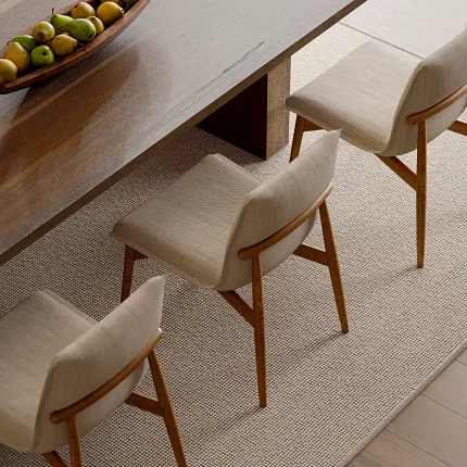 Elegant dining room featuring 100% wool carpet flooring Dining room with wooden table and chairs on 100% wool carpet