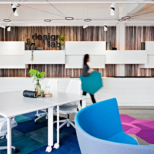 Modern education facility with vibrant blue and purple commercial carpet tiles