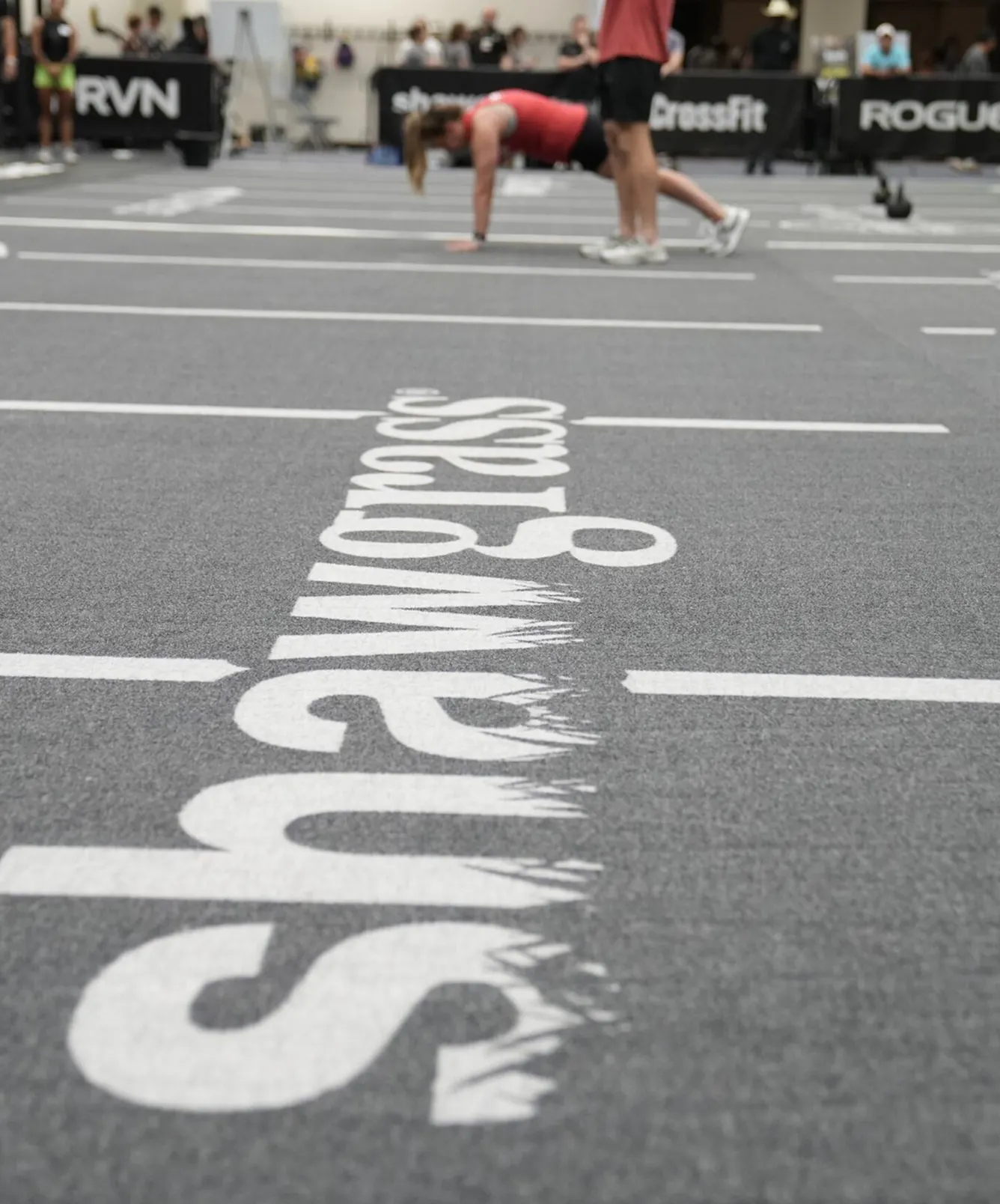 Gym flooring with Shawgrass logo and people exercising