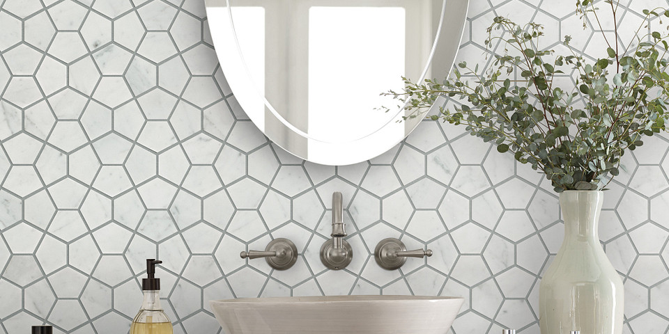 Mosaic pattern with a light tile used as a backsplash for a bathroom.