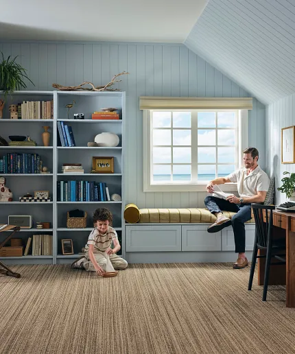 Comfortable broadloom flooring for stylish home offices Broadloom carpet in a cozy home office with bookshelves and window seat