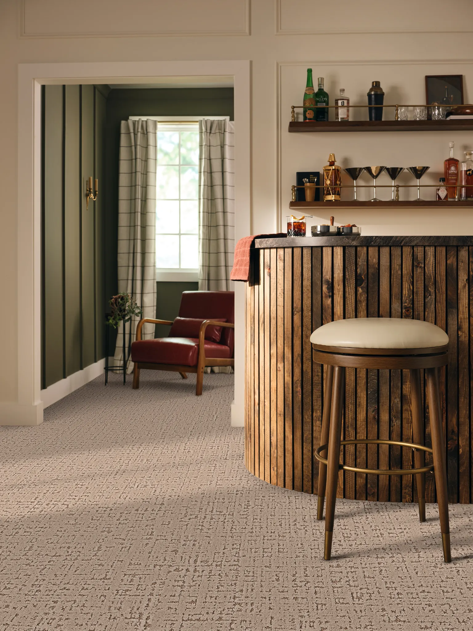 Beige carpet flooring in a cozy home bar setting