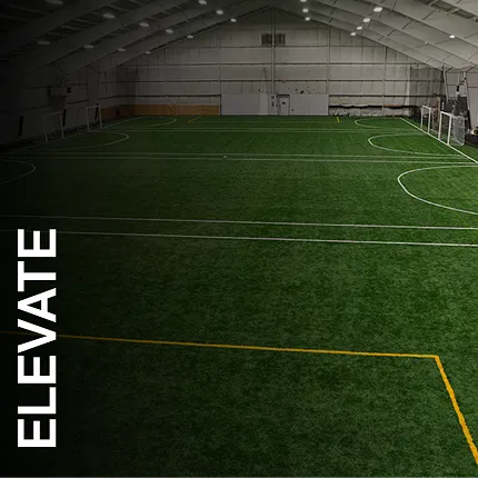 Artificial Turf in Indoor Sports Facility Indoor sports facility with artificial turf and soccer goals