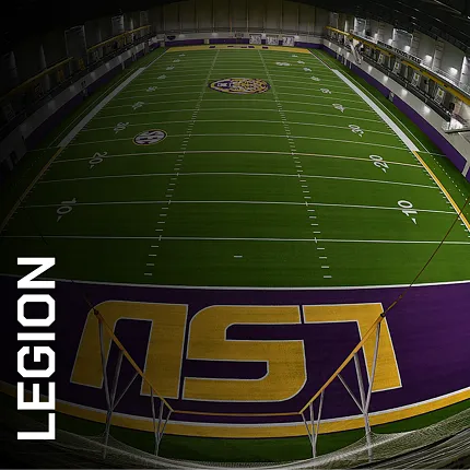 Artificial Turf in Indoor Sports Facility with LSU Logo and Legion Branding Indoor sports facility with artificial turf featuring LSU logo and Legion branding