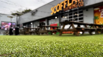 Durable outdoor artificial turf for commercial spaces Artificial grass flooring outside a brewery