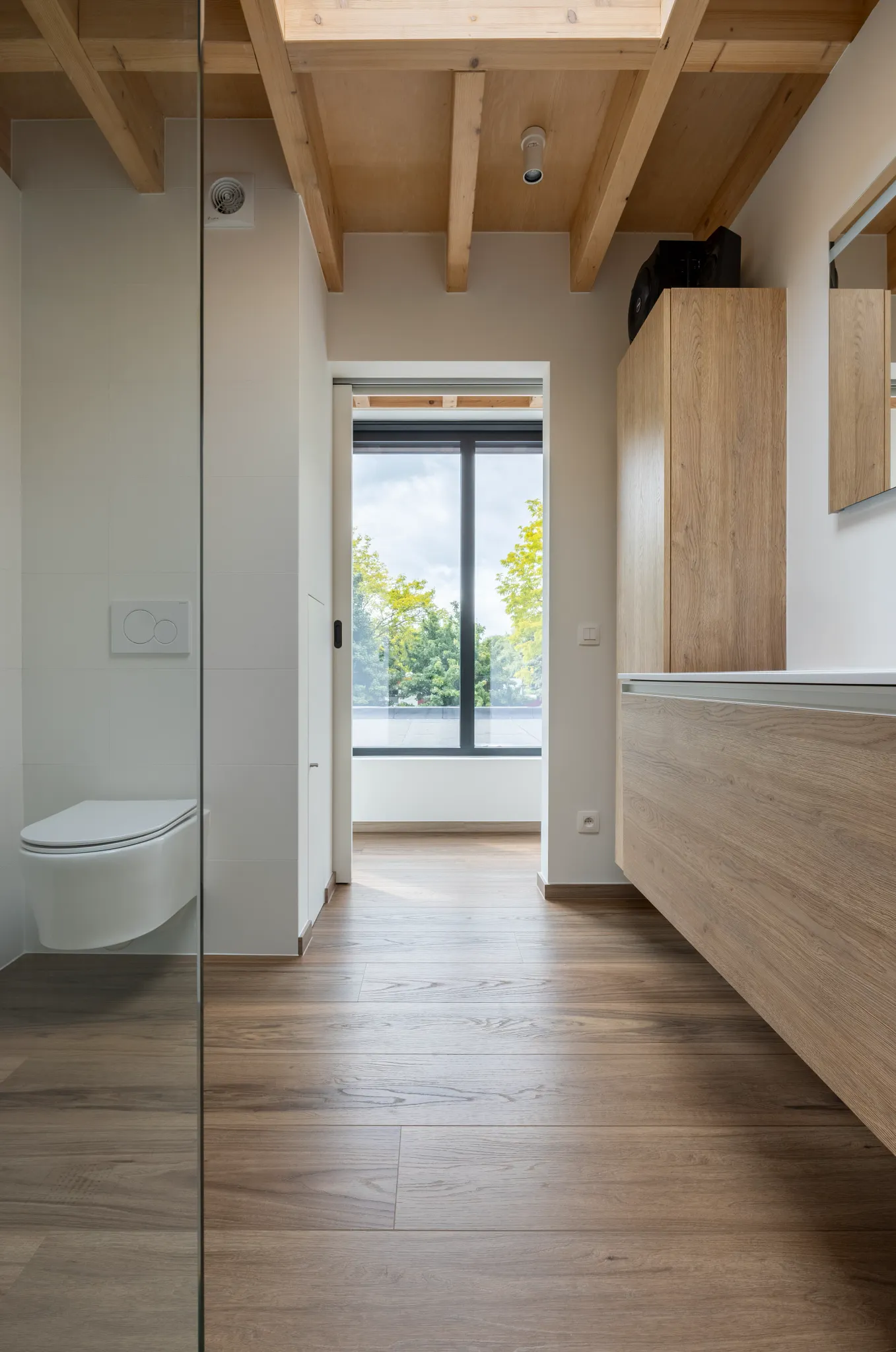 Wood oak look luxury vinyl plank floor shade dark brown in industrial bedroom