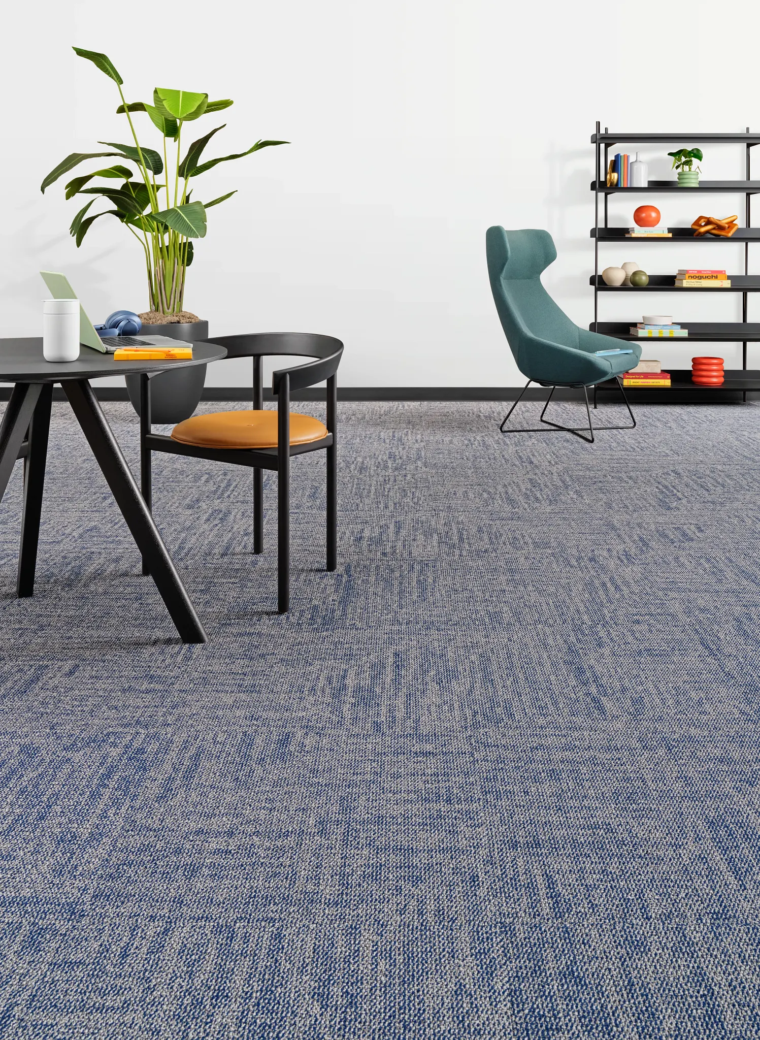 Modern office space with blue carpet tile flooring