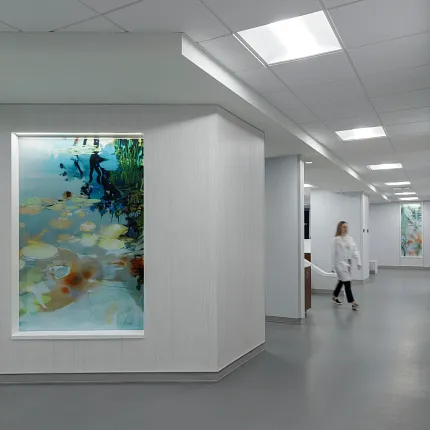 Healthcare Facility with Gray Flooring and Abstract Art Decor Modern healthcare facility hallway with gray flooring and abstract wall art
