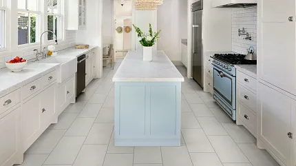 Light Gray Tile Flooring in Contemporary Kitchen Setting Modern kitchen with light gray tile flooring, white cabinetry, and a blue island