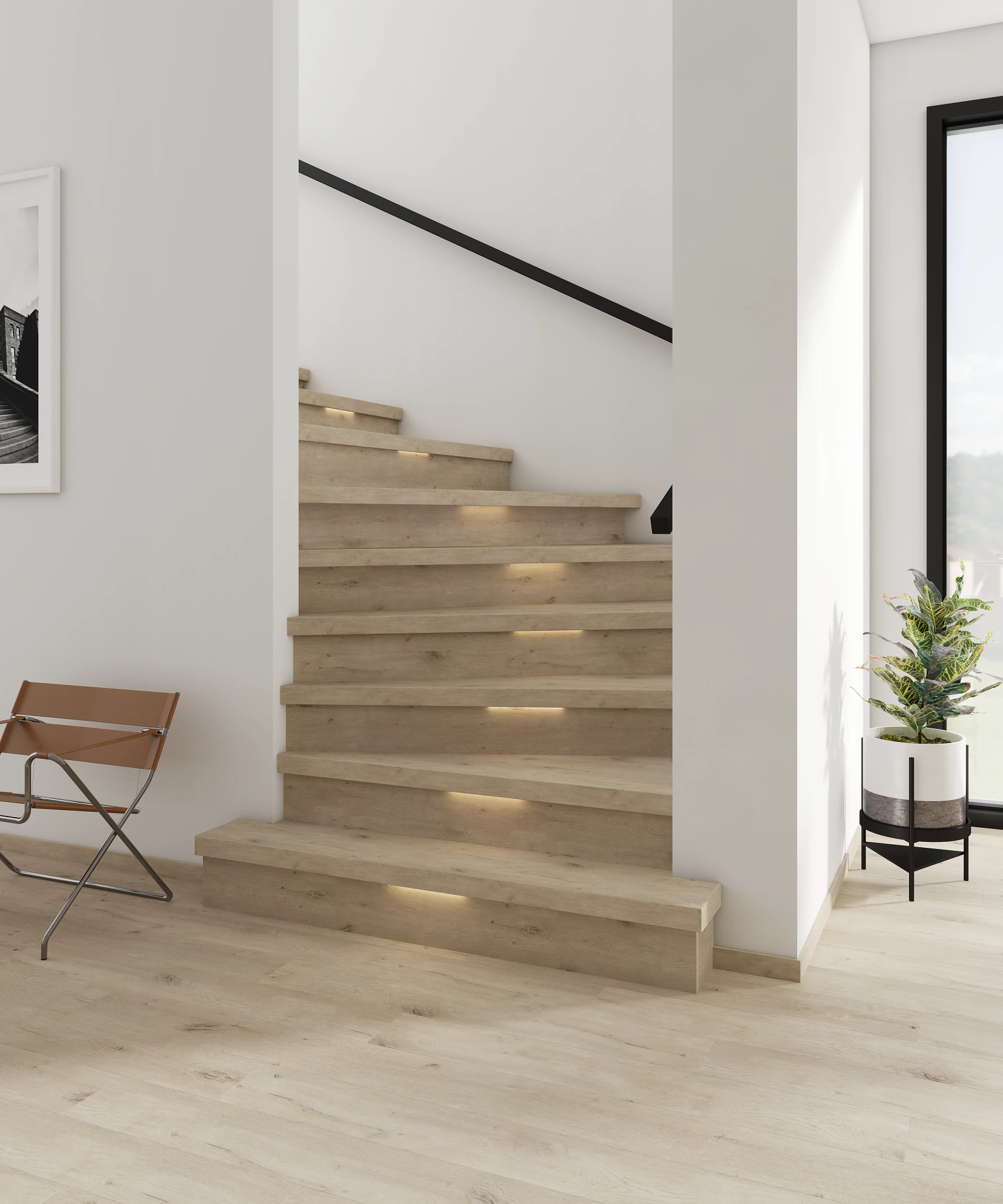Modern staircase with light wood look luxury vinyl plank flooring in a bright residential setting
