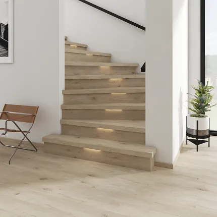 Light Wood Look Luxury Vinyl Plank Flooring in Modern Home Interior Modern staircase with light wood look luxury vinyl plank flooring in a bright residential setting