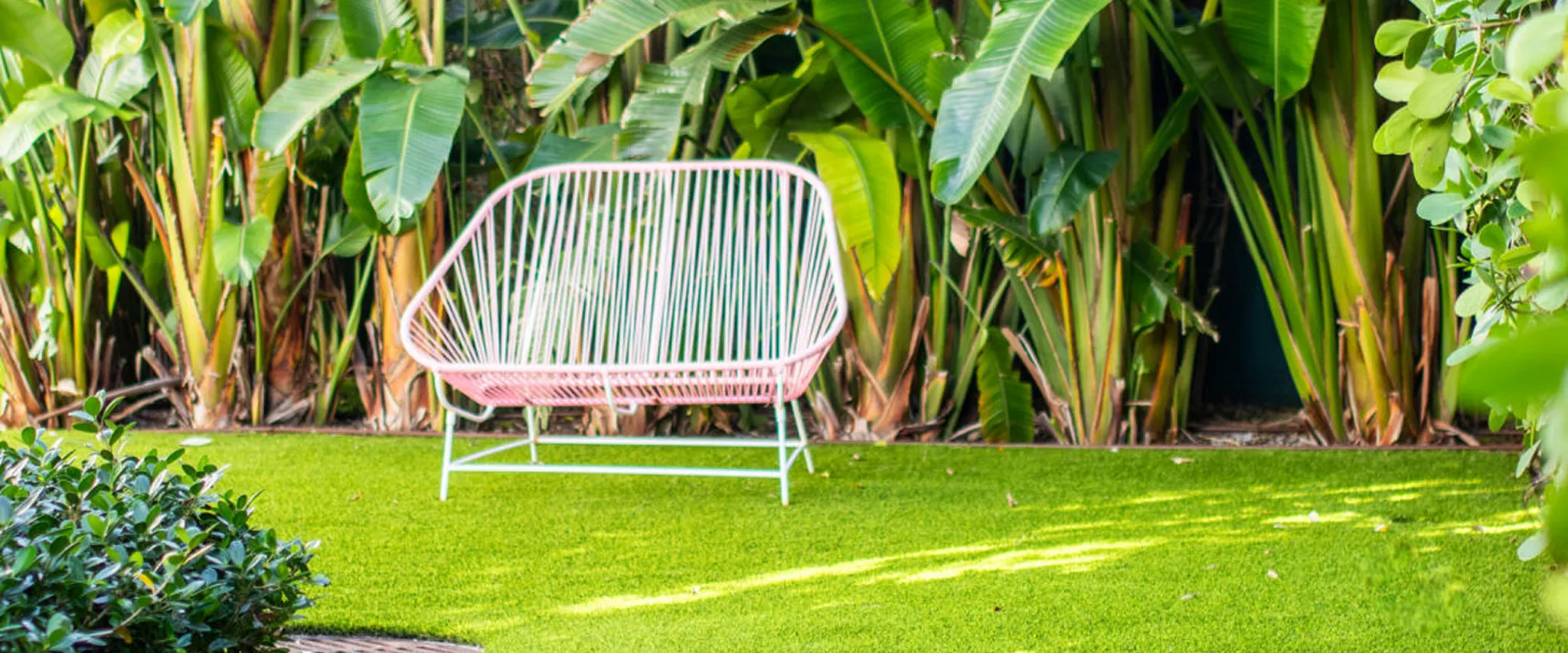 Outdoor seating on lush green artificial grass