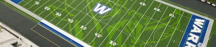 Warren Warriors Football Field with Artificial Turf Aerial view of a football field with artificial turf featuring the "Warren Warriors" logo and markings