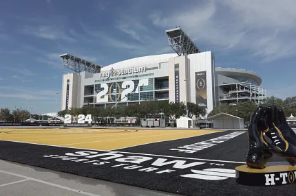 NRG Stadium artificial turf field and H-Town sculpture NRG Stadium with artificial turf field and H-Town glove sculpture