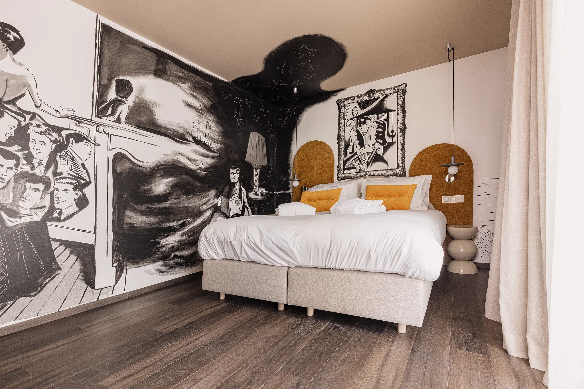 Bedroom with mural design and dark wooden Coretec floor