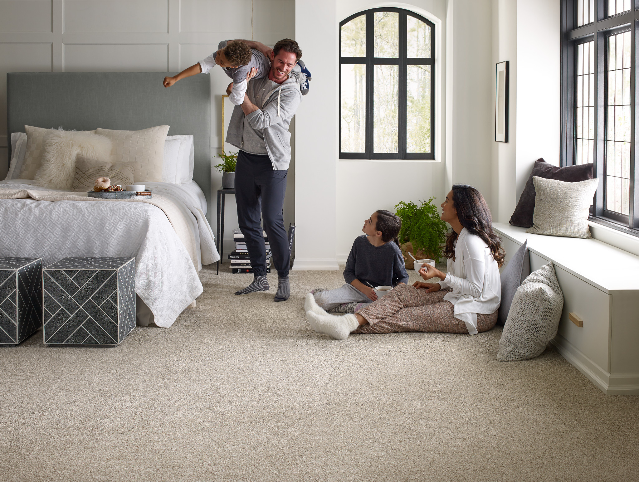 Family in a room, dad playing with son