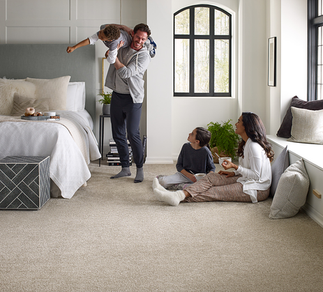 Family in a room, dad playing with son