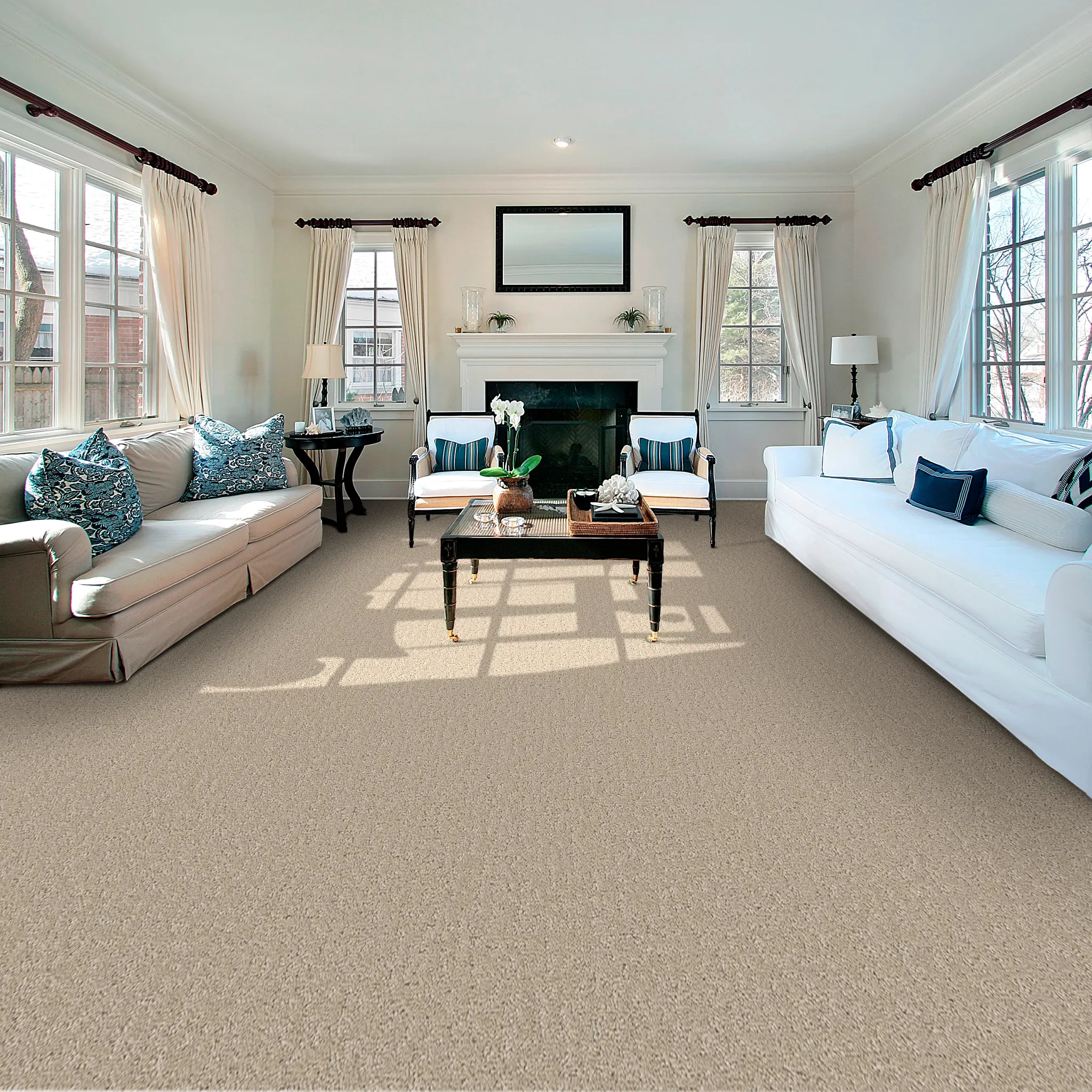 Soft surface flooring in a modern living room with gray carpet, brown leather chairs, and a black coffee table with a plant