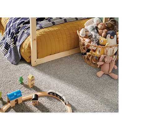Children's bedroom with soft carpet and plushies