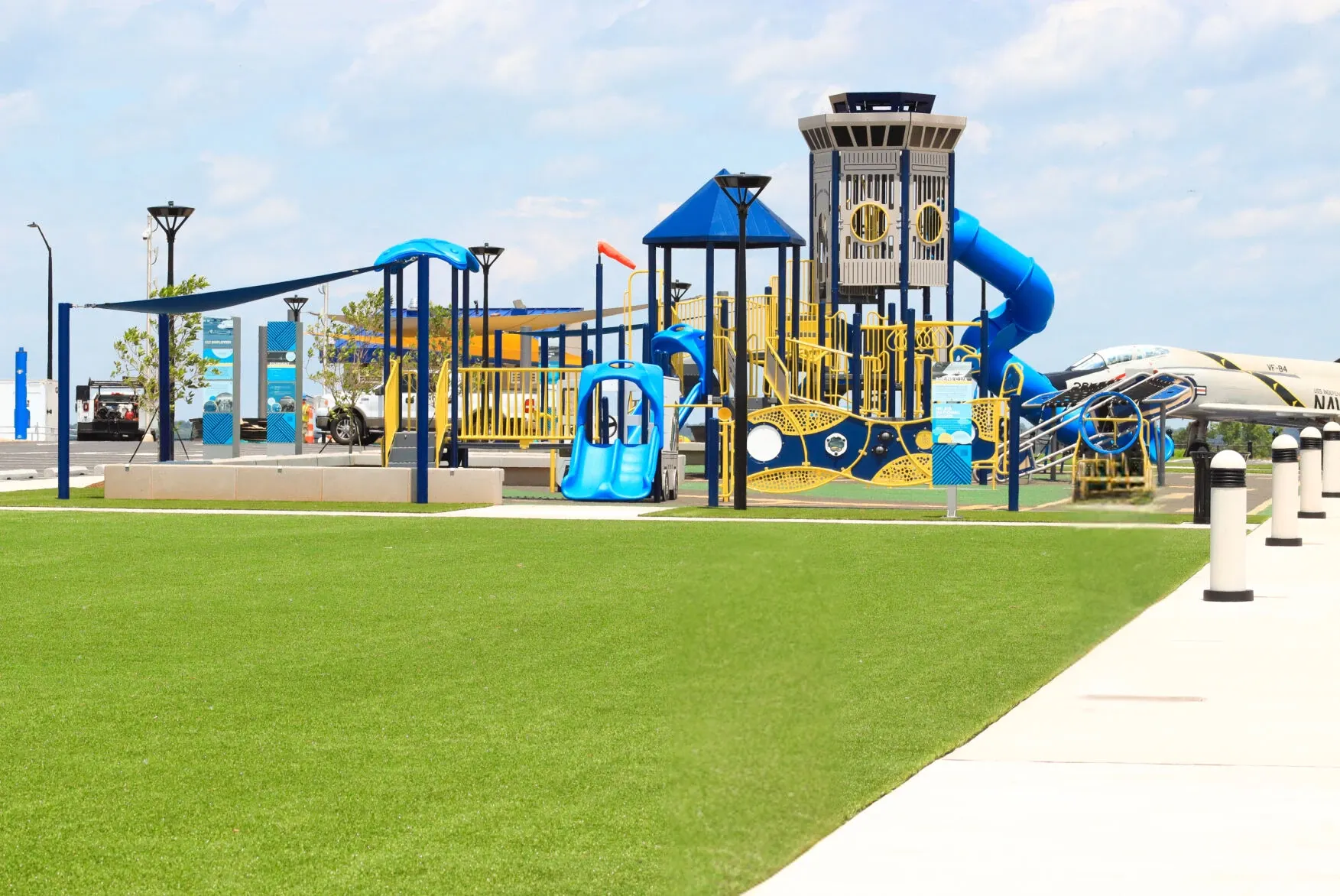 Playground with artificial grass and colorful equipment