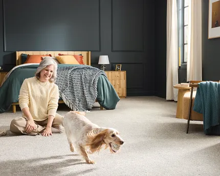 Durable carpet flooring for a cozy and comfortable bedroom setting with playful dog bedroom with durable carpet floor with a playful dog and a comfortable setting
