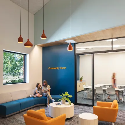 Education Facility Community Room with Commercial Carpet Tile Flooring Community room with modern seating and commercial carpet tile flooring in an education facility