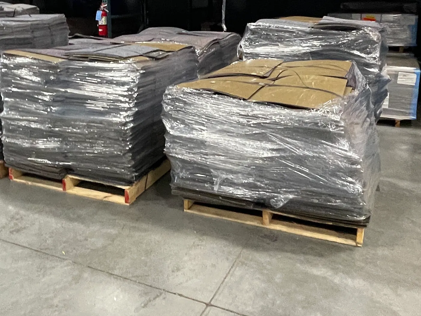 warehouse with palletized carpet tiles