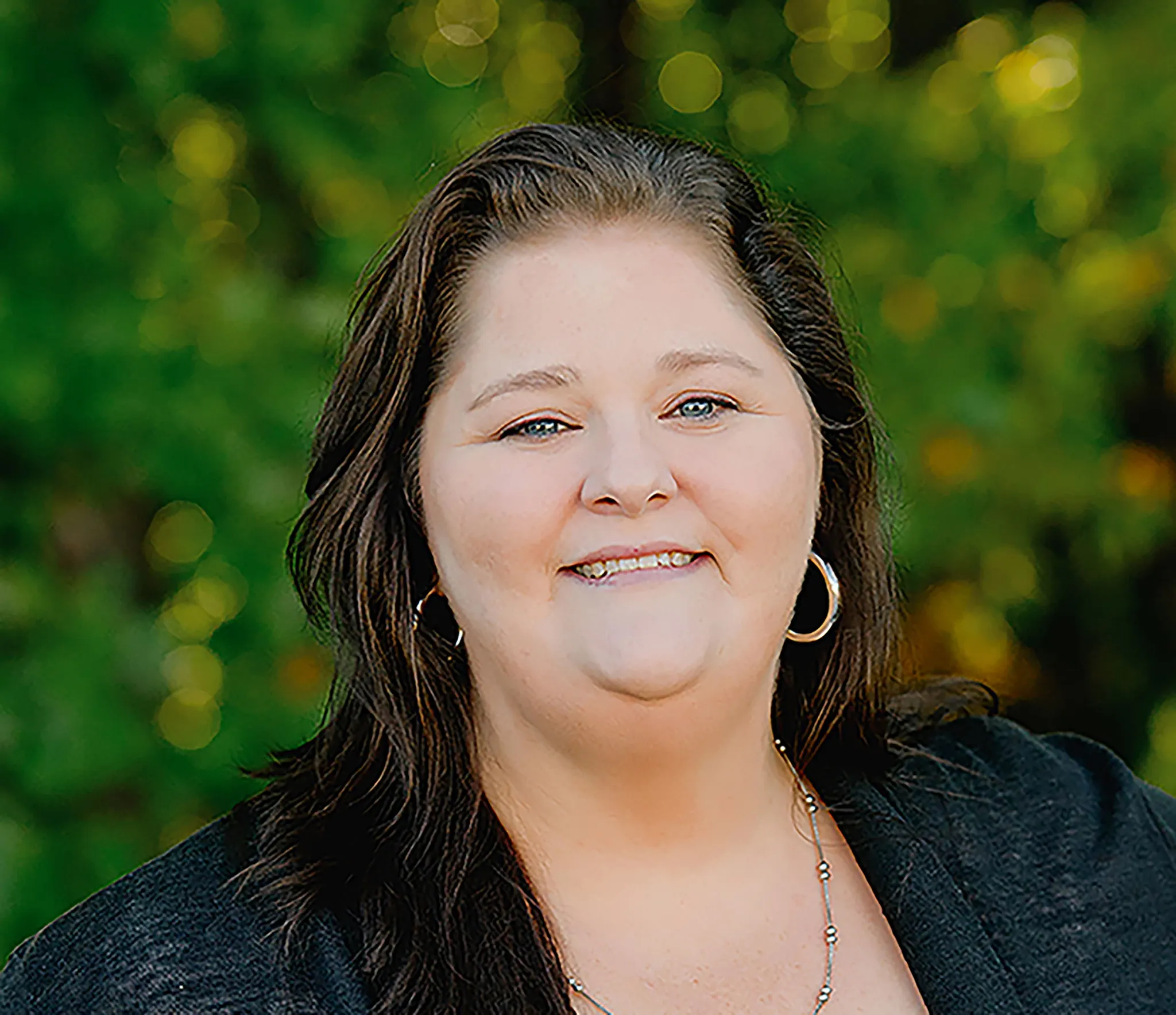 Woman in a natural outdoor setting with blurred face