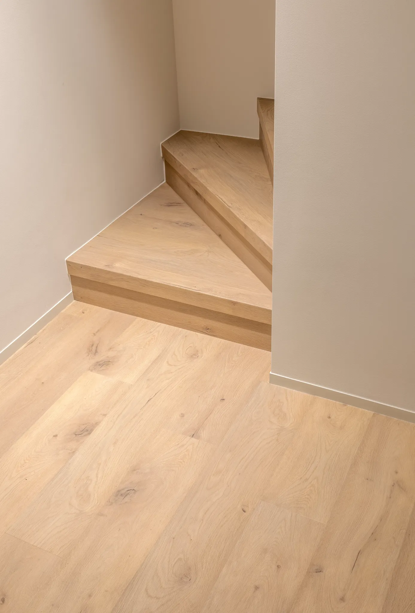 Light oak flooring on staircase and landing