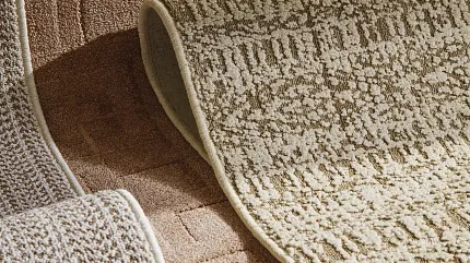 High-Quality Beige and Brown Carpet Textures Close-up view of textured beige and brown carpet swatches with geometric and linear patterns