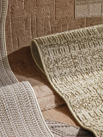 High-Quality Beige and Brown Carpet Textures Close-up view of textured beige and brown carpet swatches with geometric and linear patterns