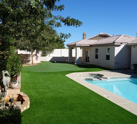 Turf in a backyard with a pool
